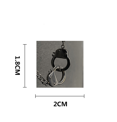 A small pendant or charm shaped like two interlocked handcuffs on a chain, shown with dimension labels indicating 1.8 cm height and 2 cm width on a white background.