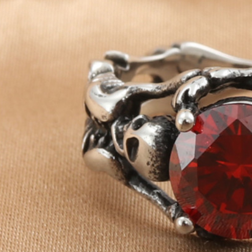 Crimson Relic Titanium Steel Ring, red stone and skull detail view
