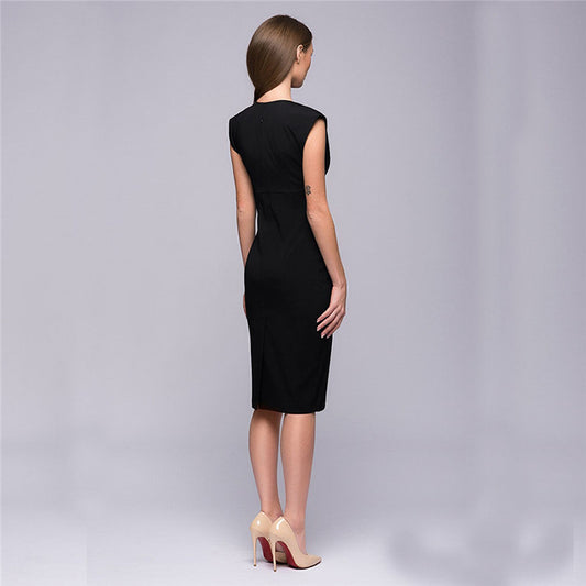 Woman wearing a black dress on a gray background