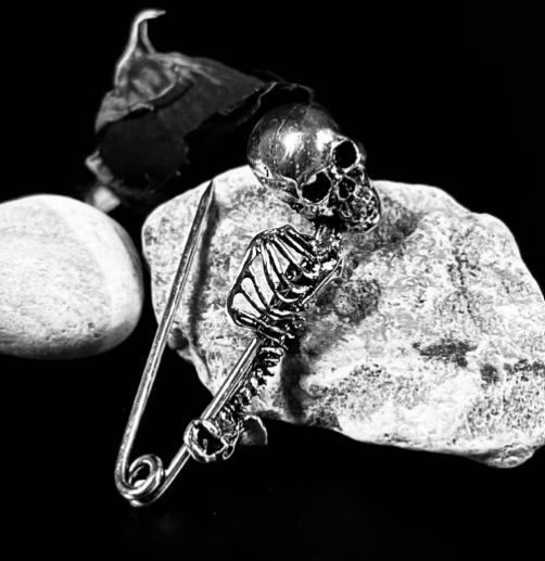 Skull lapel brooch with vintage-finished detailing, product view