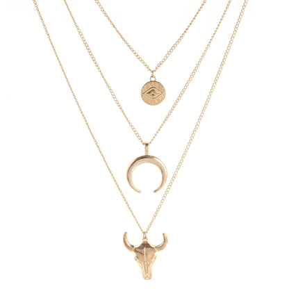 Three gold necklaces with different designs on a white background
