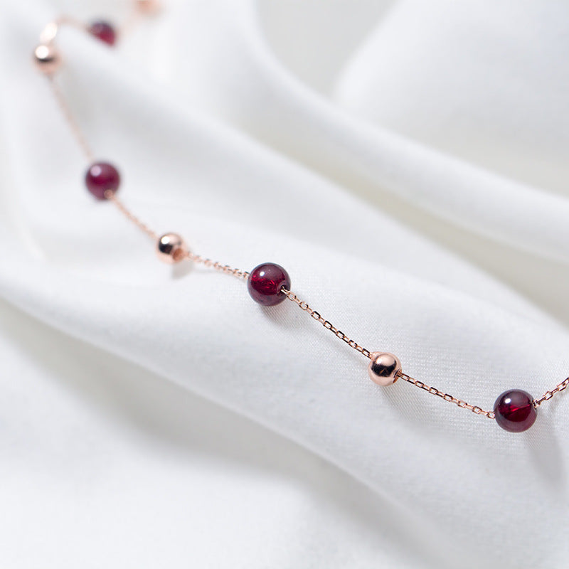 Crimson Thread garnet necklace with delicate chain, detail view