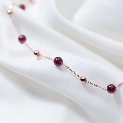 Crimson Thread garnet necklace with delicate chain, detail view