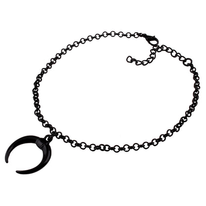 Black chain bracelet with a unique pendant on a white background