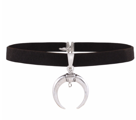 Black choker necklace with silver crescent moon pendant on a white background