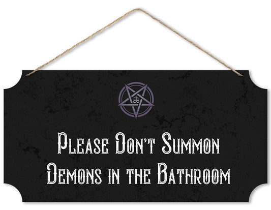 Black sign with white text 'Please Don't Summon Demons in the Bathroom' and a pentagram symbol on a white background.