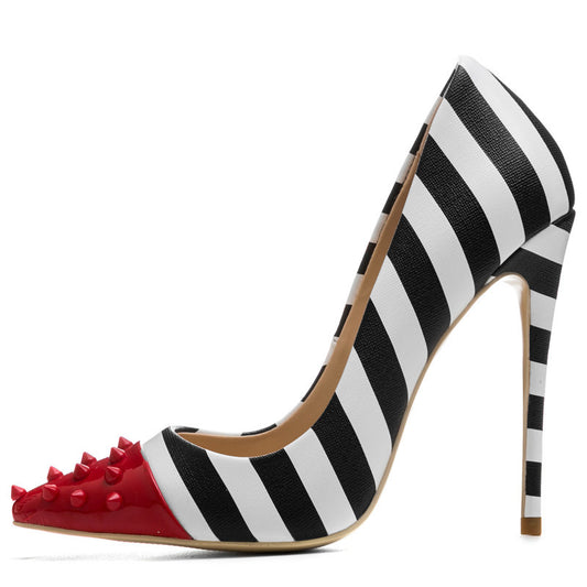 Black and white striped high-heeled shoe with red studded detail on a white background
