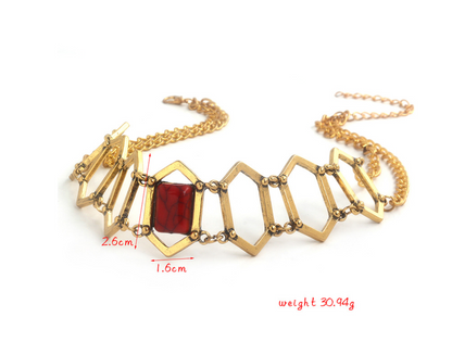 Gold necklace with a red gemstone, measurements, and weight displayed on a white background