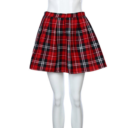 Red plaid skirt on a mannequin with white tights against a white background