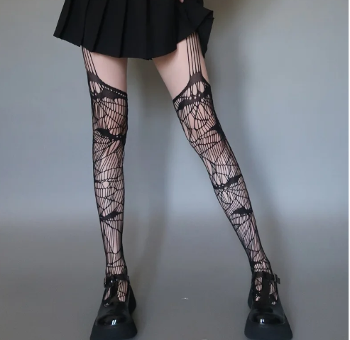 Nightwing Bat Pattern Fishnet Stockings in black, front styling view