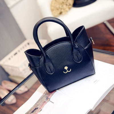 Nine Lives Cat Pattern Handbag in black, front view
