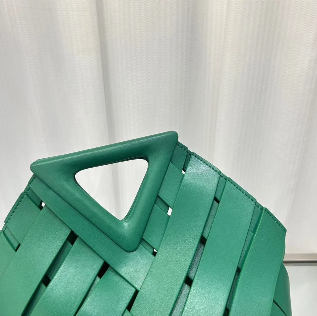 Obscura Woven Triangle-Buckle Crossbody Bag in green, woven detail view