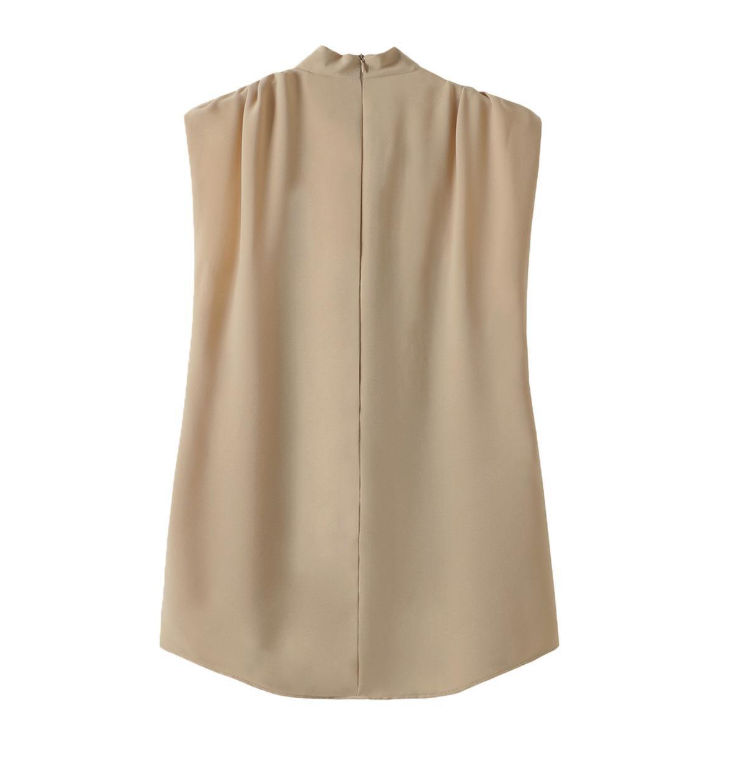 Beige sleeveless top on a white background