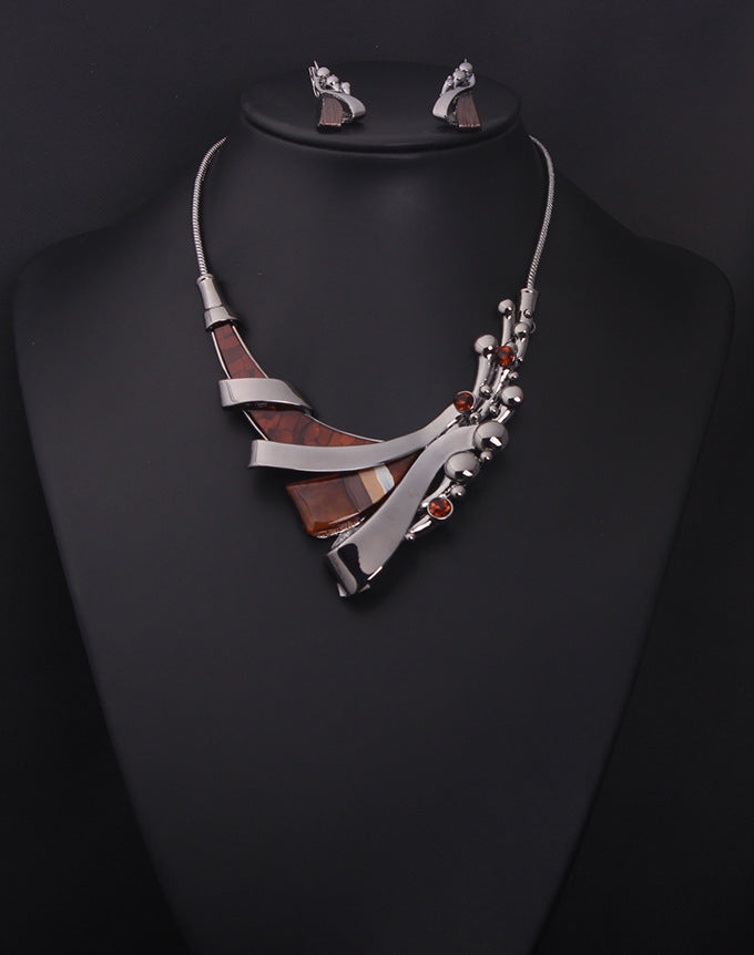 Jewelry set with necklace and earrings on a black mannequin