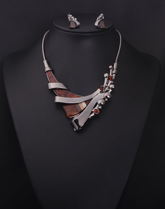 Jewelry set with necklace and earrings on a black mannequin