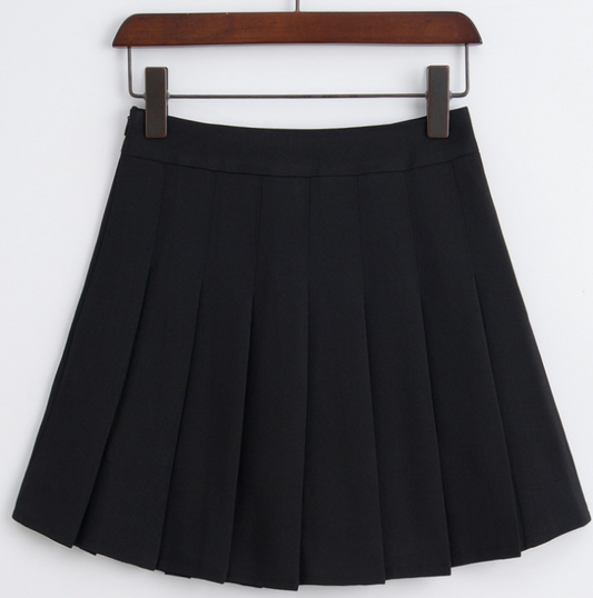 Black pleated skirt on a hanger against a white background