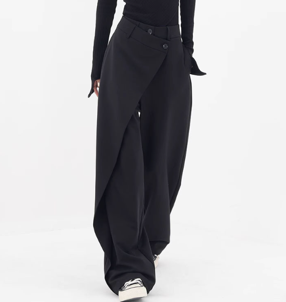 Riftline Asymmetrical Patchwork Trousers in black, walking front view