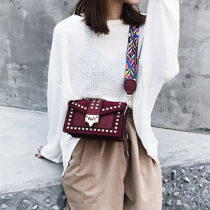 Rook Studded Velvet Crossbody Bag in red, full styling view