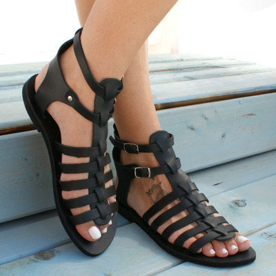 Solstice Cutout Flat Sandals in black, front styling view