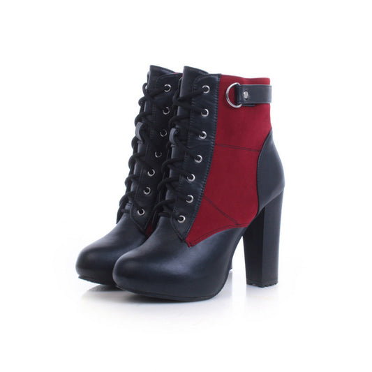 A pair of women's lace-up ankle boots with a high block heel, featuring a black faux-leather lower section and a red suede side panel, shown on a white background.