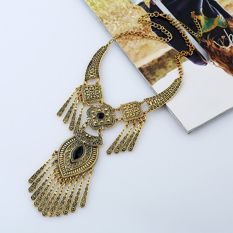 Watcher Eye gold-tone tassel necklace with black detailing