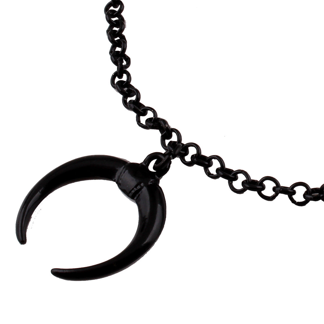 Black horn pendant on a chain against a white background
