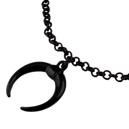 Black horn pendant on a chain against a white background