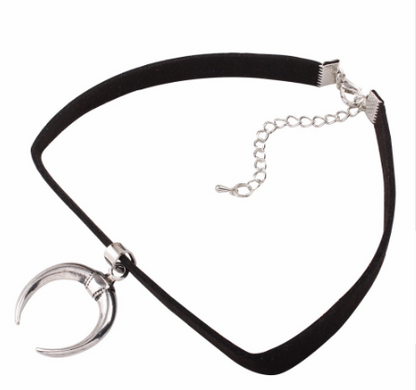 Black choker necklace with silver crescent moon pendants on a white background