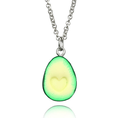 Avocado-shaped pendant on a chain against a white background